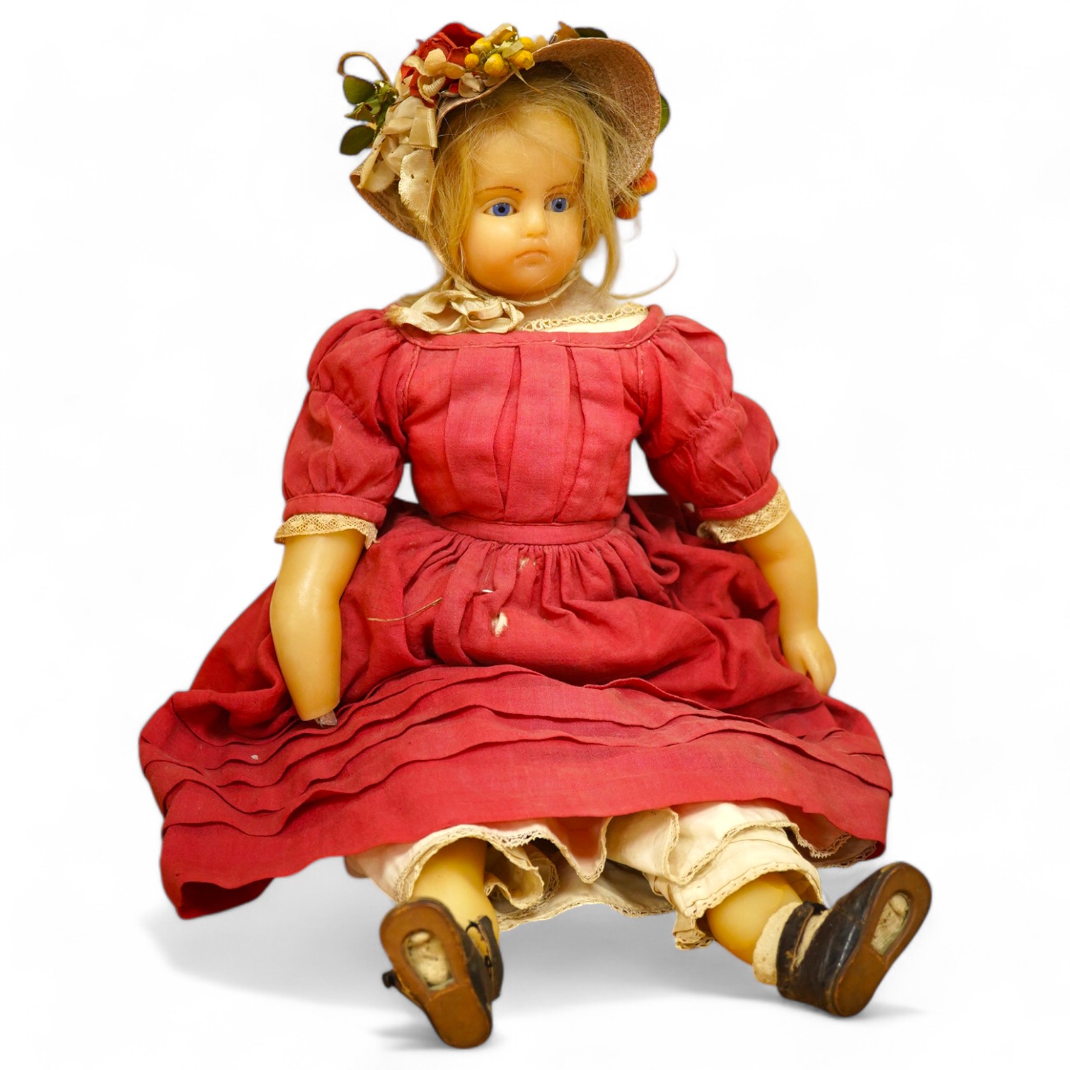 A 19th century poured wax shoulder doll, paperweight eyes and jointed limbs, 60cm. Condition - some damage